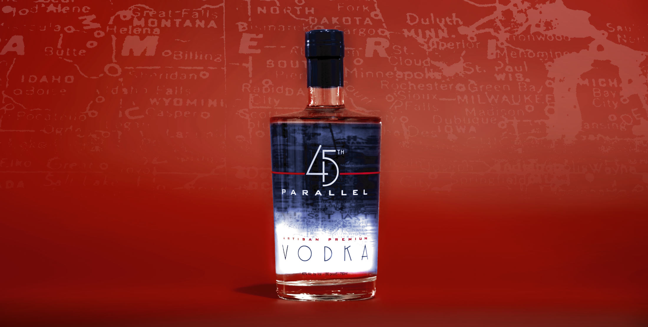 A vodka bottle photographed on a red background. 45th parallel vodka